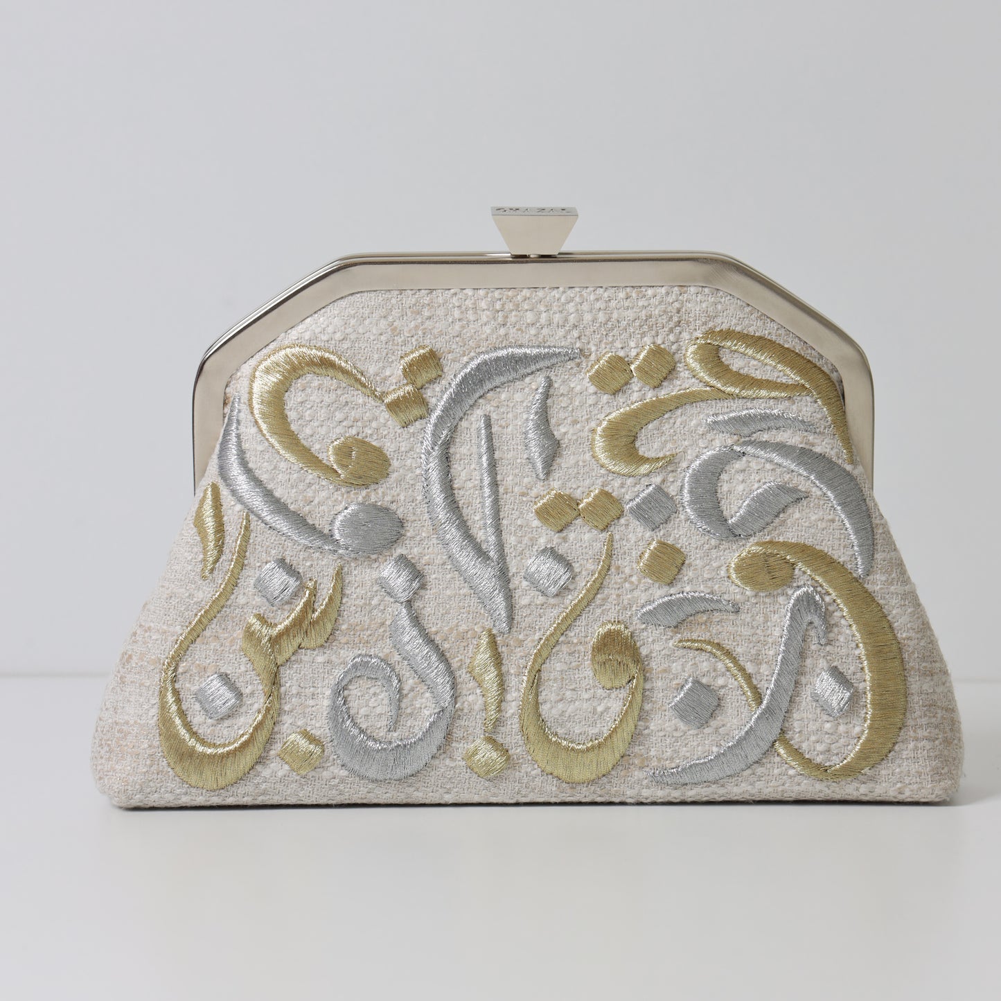 CALLIGRAPHY TRAPEZE CLUTCH