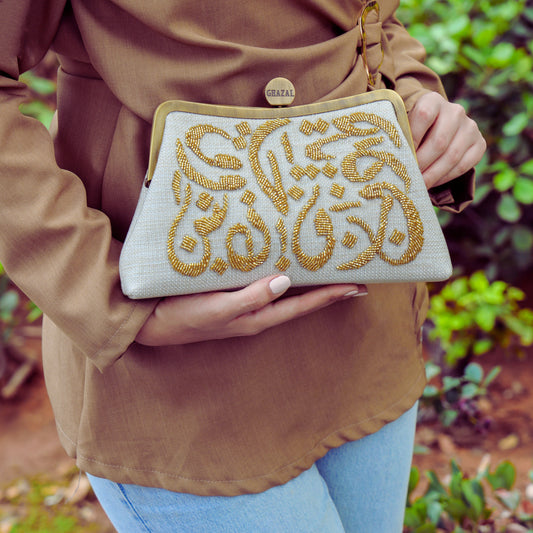 The Calligraphy Bronze Clutch: Where Arabic Art Meets Luxury Fashion - The Calligraphy Bronze Clutch: Where Arabic Art Meets Luxury Fashion journal image about Arabic calligraphy bags, luxury clutch gifts, and handmade bags Lebanon - Designer bags Lebanon, Women handmade clutch bag, personalized bags with name, Beirut clutch, Clutch Lebanon, Personalized bags Lebanon, Handmade clutch bags, Iraq clutch calligraphy, Palestine clutch