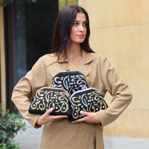 CALLIGRAPHY TRAPEZE CLUTCH