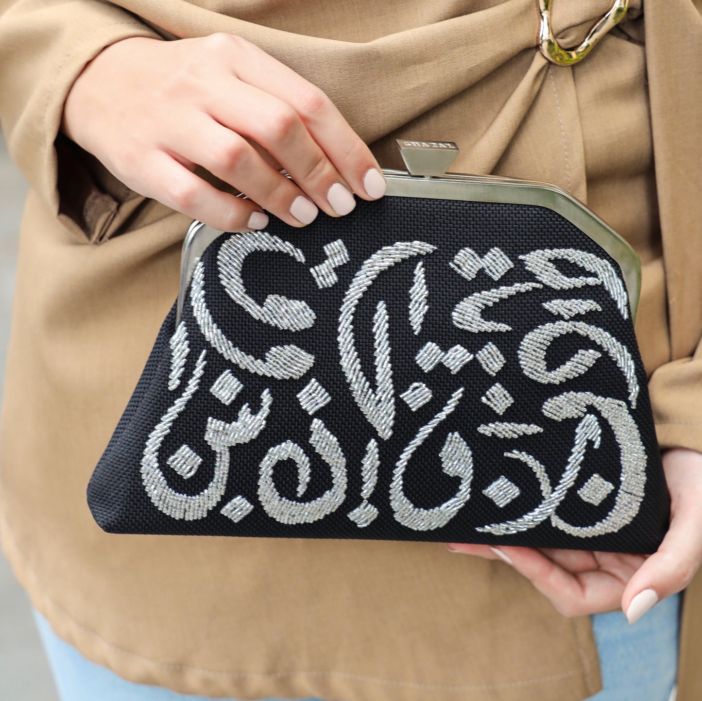 CALLIGRAPHY TRAPEZE CLUTCH