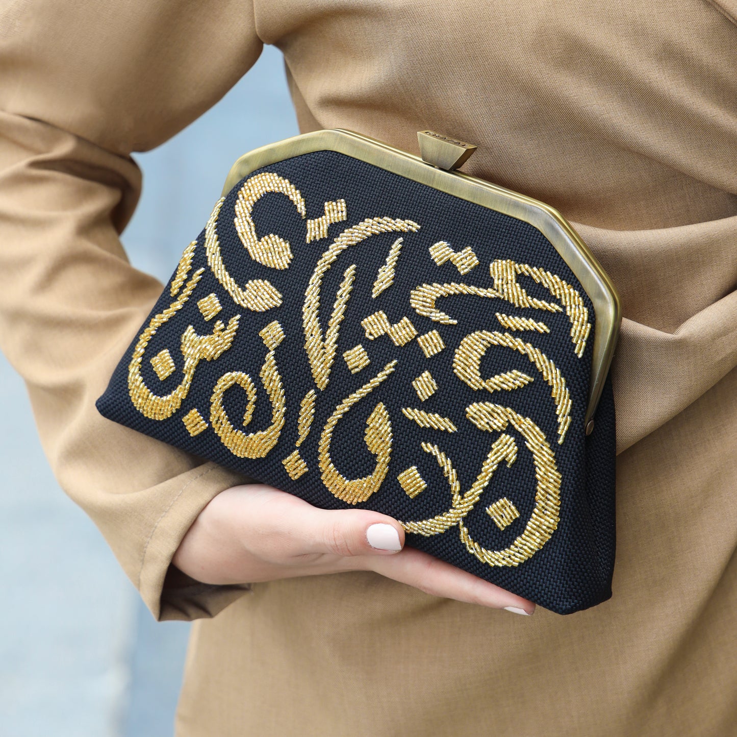 CALLIGRAPHY TRAPEZE CLUTCH