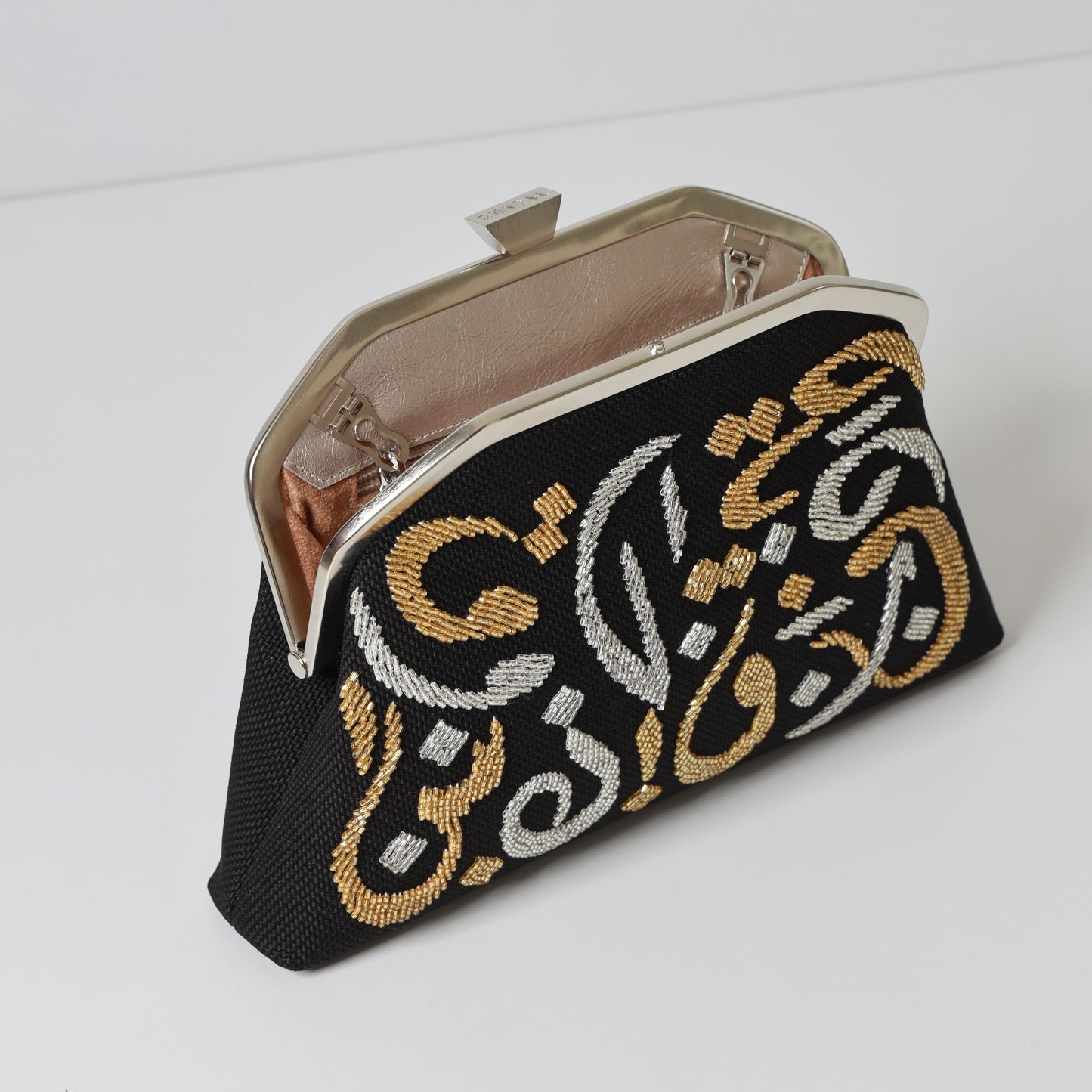 CALLIGRAPHY TRAPEZE CLUTCH