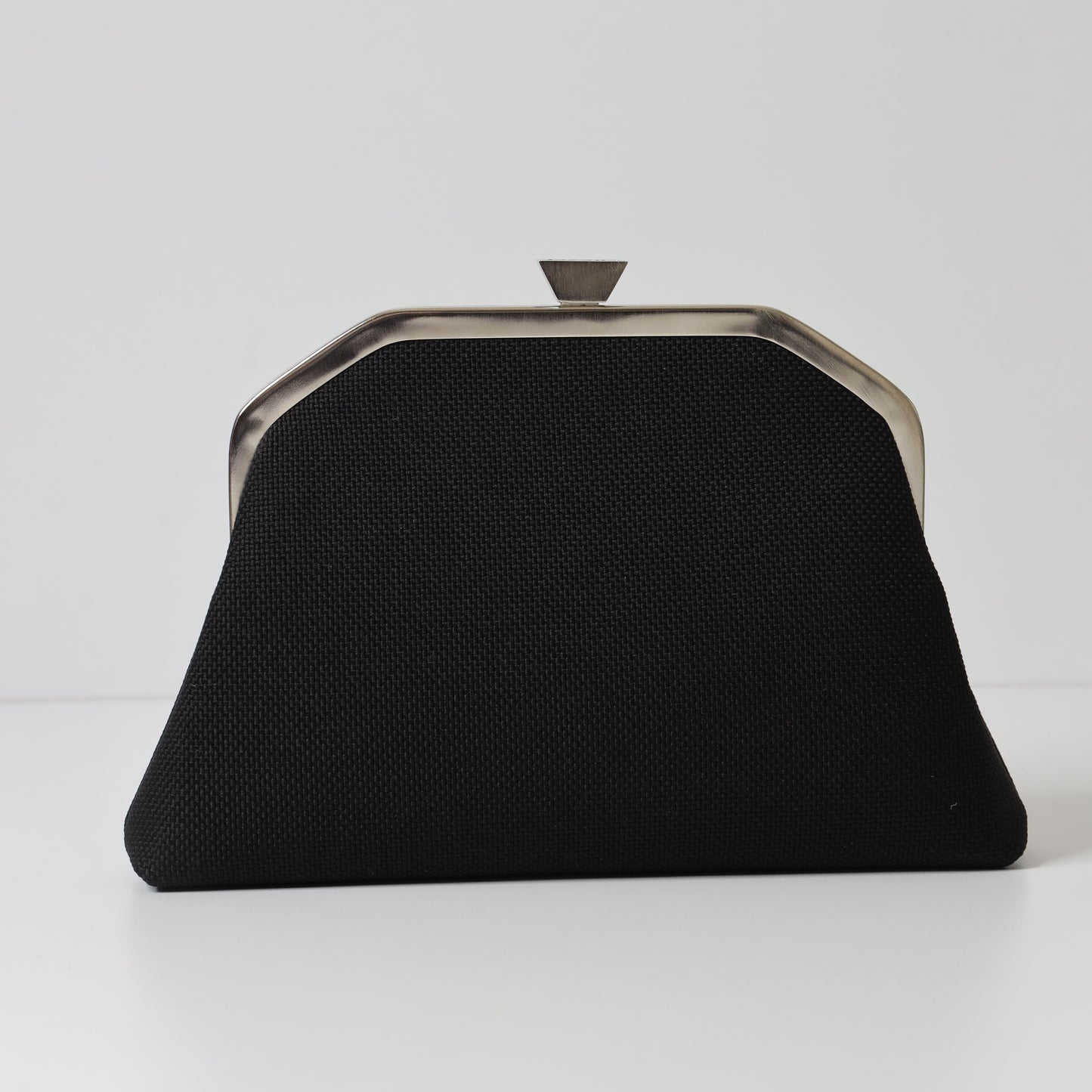 CALLIGRAPHY TRAPEZE CLUTCH